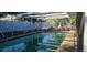 Outdoor pool is surrounded by a screened enclosure and fencing at 3717 Mckay Creek Dr, Largo, FL 33770