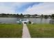 Tranquil waterfront view from the backyard with a private dock at 3839 Star Island Dr, Holiday, FL 34691
