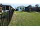 Well-maintained fenced backyard with manicured lawn at 3839 Star Island Dr, Holiday, FL 34691