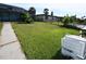Lush backyard leading to a fenced area, showcasing the lot's generous size and outdoor potential at 3839 Star Island Dr, Holiday, FL 34691