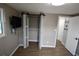 Bedroom with wood-look flooring, a large closet, and natural light at 3839 Star Island Dr, Holiday, FL 34691