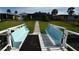 Charming waterfront home with a private dock and seating, ideal for relaxing by the water at 3839 Star Island Dr, Holiday, FL 34691