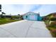 Wide driveway leading to a single-story home with a well-kept front yard and inviting curb appeal at 3839 Star Island Dr, Holiday, FL 34691