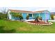 Well-manicured front lawn complements the quaint home with its charming curb appeal and inviting entrance at 3839 Star Island Dr, Holiday, FL 34691