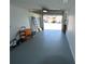 A tidy, organized garage with an open garage door at 3839 Star Island Dr, Holiday, FL 34691
