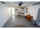 Garage with entry door to the home, washer, and refrigerator at 3839 Star Island Dr, Holiday, FL 34691