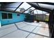 A comfortable lanai provides outdoor living and storage with a garden view at 3839 Star Island Dr, Holiday, FL 34691