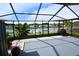 Relaxing screened lanai boasts serene water views, perfect for entertaining or unwinding at 3839 Star Island Dr, Holiday, FL 34691