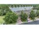 Overhead shot of lakeside townhouses, highlighting the community's attractive layout and proximity to water at 3922 Silverlake Way, Wesley Chapel, FL 33544