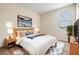 Comfortable bedroom featuring a large bed, stylish rug, and neutral decor for a relaxing atmosphere at 3922 Silverlake Way, Wesley Chapel, FL 33544