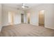 Spacious bedroom with multiple doors leading to bathroom and closet areas; room has carpet at 3922 Silverlake Way, Wesley Chapel, FL 33544
