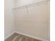 Small walk-in closet with carpet and a metal rod for organized storage and hanging clothes at 3922 Silverlake Way, Wesley Chapel, FL 33544