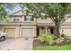 Charming townhome with a well-maintained brick driveway and lush landscaping at 3922 Silverlake Way, Wesley Chapel, FL 33544