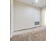 Neutral hallway featuring carpeted floors, white walls, and access to an enclosed storage area at 3922 Silverlake Way, Wesley Chapel, FL 33544