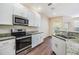 Kitchen featuring granite countertops and stainless steel appliances at 3922 Silverlake Way, Wesley Chapel, FL 33544
