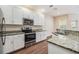 Well-equipped kitchen with stainless steel appliances and bright countertops at 3922 Silverlake Way, Wesley Chapel, FL 33544