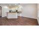 Bright kitchen features granite countertops, stainless steel appliances and white cabinets at 3922 Silverlake Way, Wesley Chapel, FL 33544
