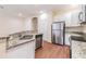 Modern kitchen features stainless appliances and granite countertops at 3922 Silverlake Way, Wesley Chapel, FL 33544