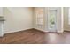 Sunlit living room area with door leading to outside at 3922 Silverlake Way, Wesley Chapel, FL 33544