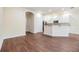 Modern living space with beautiful hardwood floors and open access to the kitchen at 3922 Silverlake Way, Wesley Chapel, FL 33544