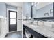 Contemporary bathroom with a granite countertop, stylish sink, shower, and access door at 4049 Wellington Pkwy, Palm Harbor, FL 34685