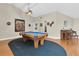Spacious game room featuring a pool table, piano, and vaulted ceilings at 4049 Wellington Pkwy, Palm Harbor, FL 34685