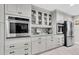 Gourmet kitchen with stainless steel appliances, custom cabinetry, and ample counter space at 4049 Wellington Pkwy, Palm Harbor, FL 34685