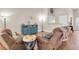 Cozy living room with wood floors, comfortable seating, and a decorative wall hanging at 4049 Wellington Pkwy, Palm Harbor, FL 34685