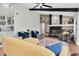 Cozy living room with fireplace, vaulted ceilings, wood floors, and plenty of seating at 4049 Wellington Pkwy, Palm Harbor, FL 34685