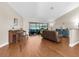Inviting living room with a piano, comfortable seating, and views of the lanai at 4049 Wellington Pkwy, Palm Harbor, FL 34685
