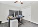 Office space featuring neutral paint, desk, ceiling fan, and ample natural light at 4049 Wellington Pkwy, Palm Harbor, FL 34685