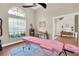 Tranquil office with large windows, massage table, and plenty of natural light at 4049 Wellington Pkwy, Palm Harbor, FL 34685