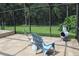 Relaxing screened patio area with stone flooring, comfortable seating and private backyard at 4049 Wellington Pkwy, Palm Harbor, FL 34685