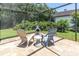 Cozy outdoor patio with comfortable seating and a chiminea for a relaxing atmosphere at 4049 Wellington Pkwy, Palm Harbor, FL 34685