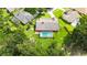 Expansive aerial view of a home featuring a large, screened-in swimming pool and lush green lawn at 414 Summit Chase Dr, Valrico, FL 33594