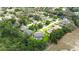 Serene aerial view showcases a residential neighborhood surrounded by lush greenery and mature trees at 414 Summit Chase Dr, Valrico, FL 33594