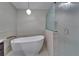Bathroom with modern soaking tub and frosted glass enclosed shower at 414 Summit Chase Dr, Valrico, FL 33594
