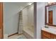 This bathroom is well-lit and features a shower with a tub and a wooden vanity at 414 Summit Chase Dr, Valrico, FL 33594