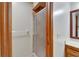 Close-up of glass-enclosed walk-in shower in bathroom with wood trim and fixtures at 414 Summit Chase Dr, Valrico, FL 33594
