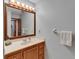 Well-lit bathroom featuring wooden vanity with a large mirror and vanity lights at 414 Summit Chase Dr, Valrico, FL 33594