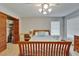 Bedroom featuring a ceiling fan, window, closet, desk, and double bed with blue bedding at 414 Summit Chase Dr, Valrico, FL 33594