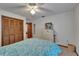 Bedroom featuring closet, ceiling fan, double bed with blue bedding, and white dresser at 414 Summit Chase Dr, Valrico, FL 33594