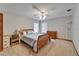 Bedroom featuring a ceiling fan, two windows, a desk, and a double bed with blue bedding at 414 Summit Chase Dr, Valrico, FL 33594
