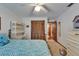 Bedroom featuring closet, ceiling fan, desk with hutch, and double bed with blue bedding at 414 Summit Chase Dr, Valrico, FL 33594
