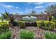 Miller Woods community entrance sign, beautifully landscaped with greenery and patriotic decor at 414 Summit Chase Dr, Valrico, FL 33594