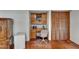 Bedroom desk with built in cabinets and closet in main bedroom at 414 Summit Chase Dr, Valrico, FL 33594