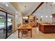 Dining room with wood table and chairs with view to kitchen and fireplace at 414 Summit Chase Dr, Valrico, FL 33594