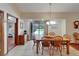 Dining room leading to screened in pool with direct entry to living quarters at 414 Summit Chase Dr, Valrico, FL 33594