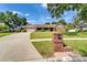 Charming single-story brick home with a well-manicured lawn, mailbox, and attached garage at 414 Summit Chase Dr, Valrico, FL 33594