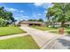 Single-story brick home with attached garage and a neatly maintained front lawn at 414 Summit Chase Dr, Valrico, FL 33594